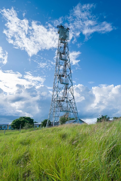 lighthouse tower on green hill