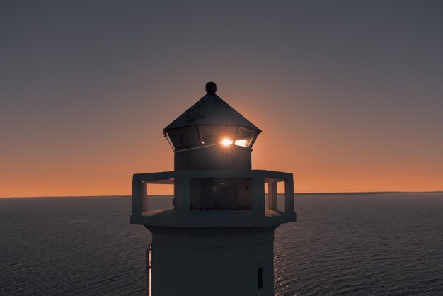 Lighthouse tower The setting sun is visible through the lighthouse