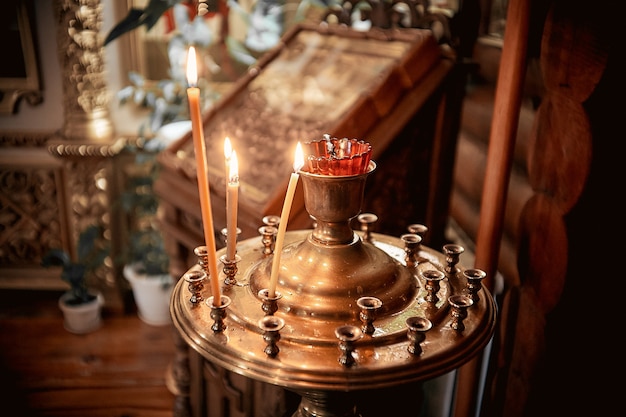 Lighting fire candles in russian orthodox church