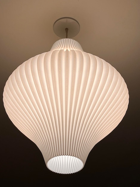 Lighting lamp shaped like folded paper