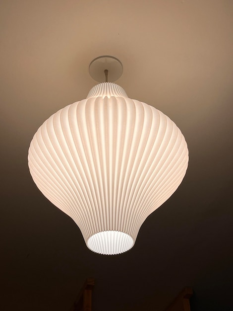 Lighting lamp shaped like folded paper