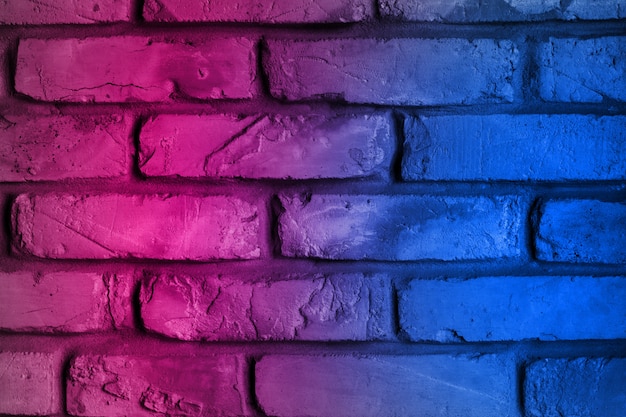 Photo lighting neon effect red and blue on brick wall for background