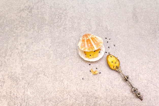 Lightly salted caviar snack with black sesame seeds and silver spoon