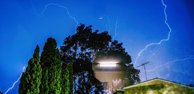 Lightning strike against blue sky