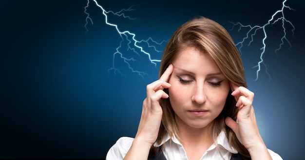 Lightning strikes and stressed woman with headache holding head