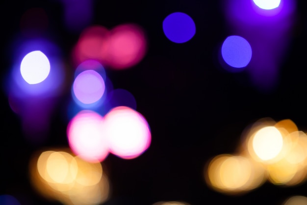 Lights blurred bokeh background from night party for your design