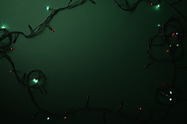 Photo lights on a dark green christmas background.