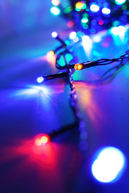 Photo lights of a lit new year garland at night, close up