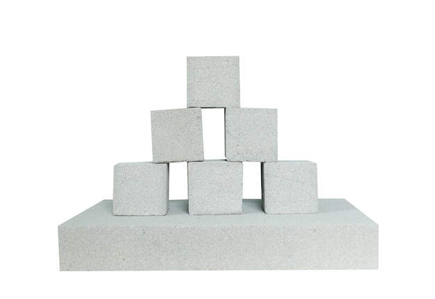 Photo lightweight construction brick isolated on white. lightweight foamed gypsum block isolated on white.