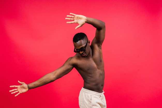 Like what you see a handsome and muscular young man posing in the studio