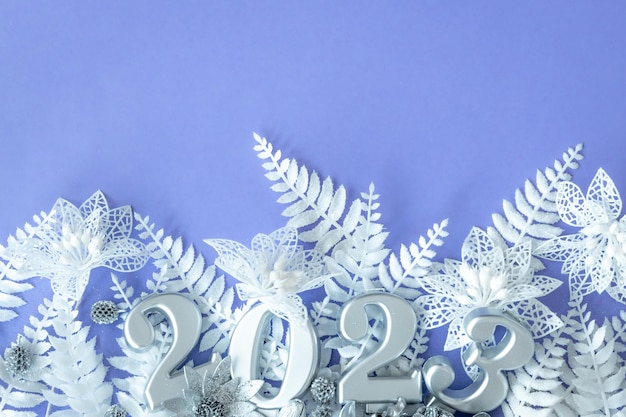 Lilac Christmas background with numbers 2023 flat lay