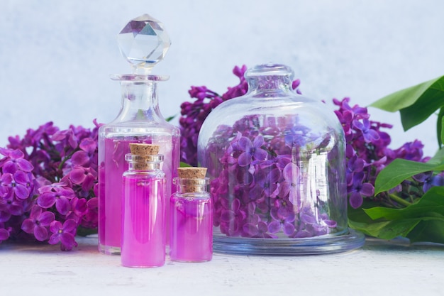 Lilac essence vials with fresh flowers