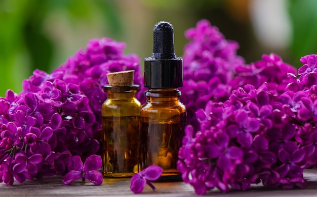 Lilac essential oil in a small bottle Selective focus