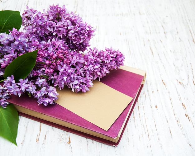 Lilac flowers and old book