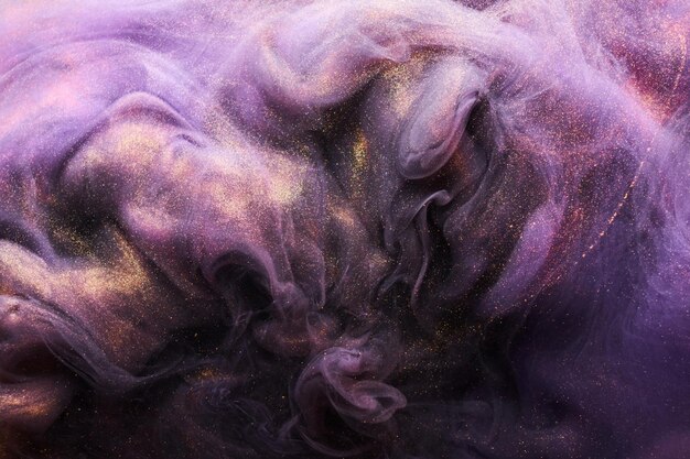 Lilac sparkling abstract background luxury gold smoke acrylic paint underwater explosion cosmic swirling ink