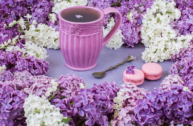  lilies of the valley, a cup of tea and macaroons