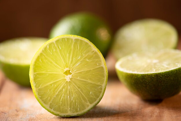 Lime cut in half on a wood table