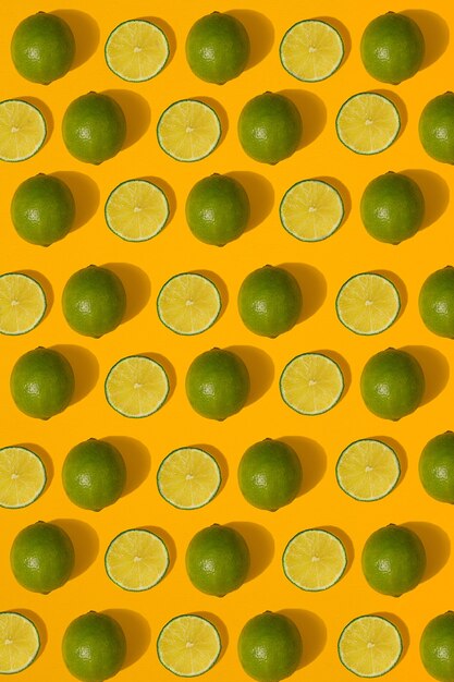 Photo lime pattern on yellow background. minimal flat lay concept. print