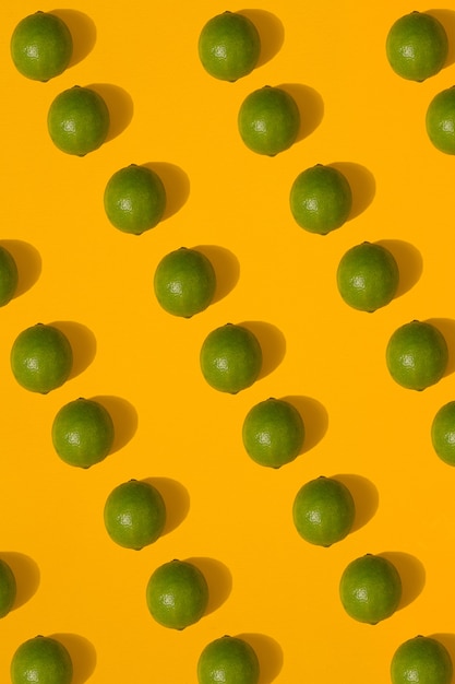 Photo lime pattern on yellow background. minimal flat lay concept. print