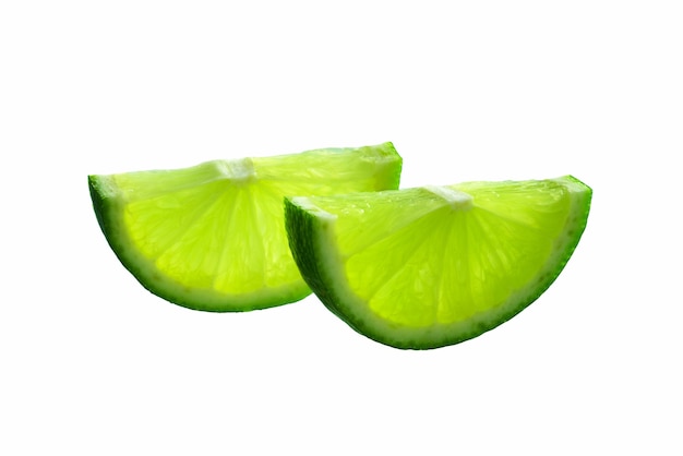 Lime slice. Juicy slice of lime iisolated on white. Ripe green lime citrus fruit.