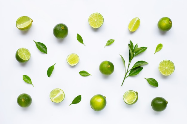 Limes with leaves isolated on white