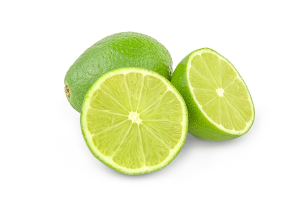 Limes with slices isolated on white