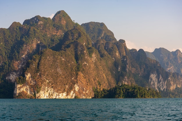 Limestone mountains with trees in the sea in Thailand