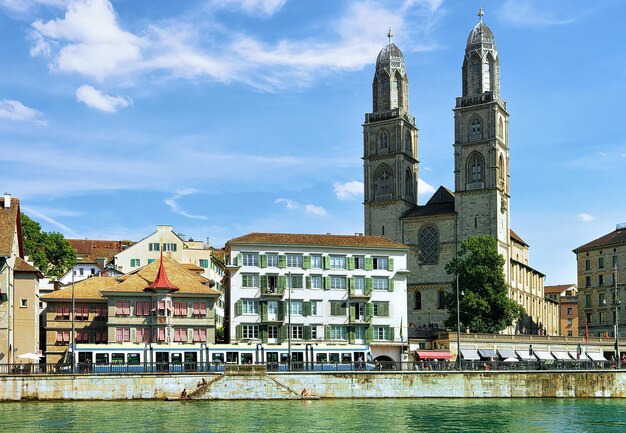 Limmatquai and Grossmunster Church Zurich, Switzerland. People on the background