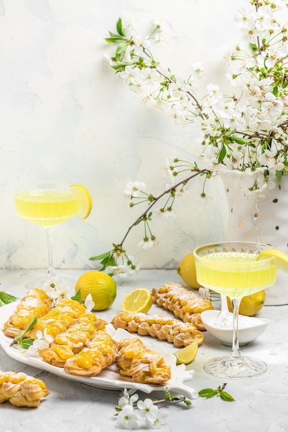 Limoncello Traditional italian homemade alcoholic drink in glass with pieces of lemon sweet Italian lemon liqueur vertical image top view place for text