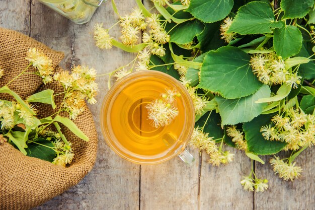 Linden tea and flowers. Selective focus.