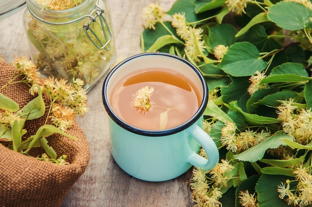 Linden tea and flowers. Selective focus.