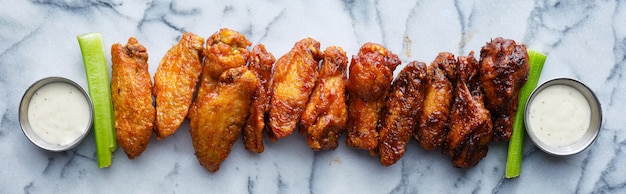 Photo line of buffalo wings with different flavors