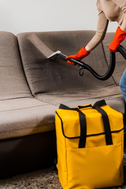 Line on couch after spraying water of dry cleaning extractor machine Domestic cleaning service cleaner is removing dirt and dust from couch using dry cleaning extraction machine