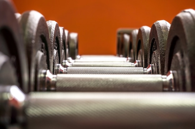 Photo line of dumbbells in the gym