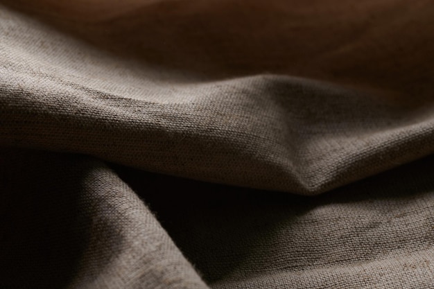 Linen crumpled texture natural fabric background closeup