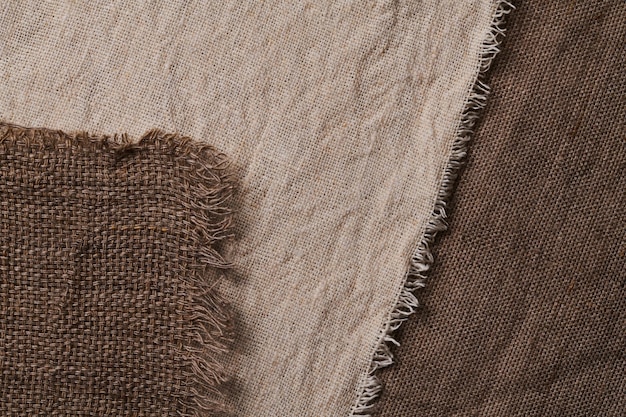 Linen in different textures and colors Natural fabrics from organic flax and cotton homespun textile handmade Burlap and canvas for eco rustic boho hygge decor closeup background