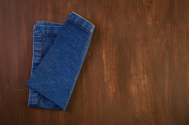 Linen dinner napkins on a wood background.