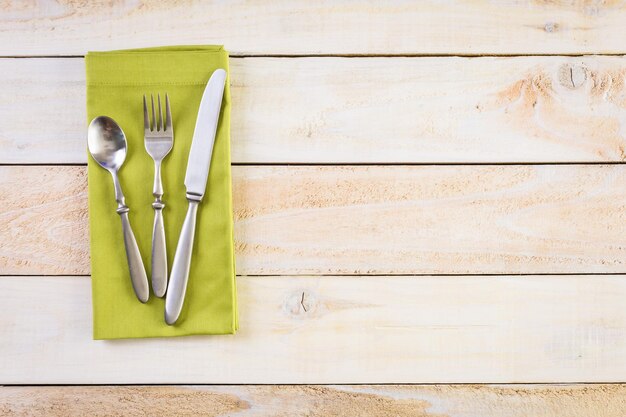 Linen dinner napkins on a wood background.