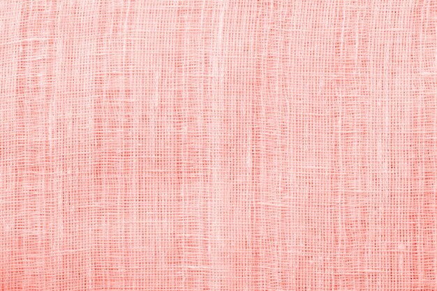 Linen fabric texture background. Zero waste concept.Living coral toned image.