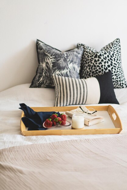 Linen pillows on a white bed with home decor Still life details in home on a bed Cozy home Sweet home