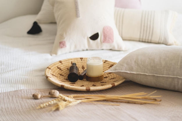 Linen pillows on a white bed with home decor Still life details in home on a bed Cozy home Sweet home