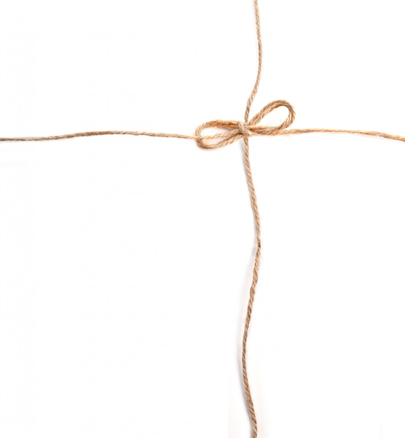 Linen rope with bows on white background