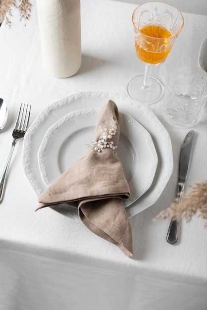 Linen white tablecloth and beige napkin