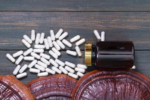 Ling zhi mushroom and capsule with bottle mockup