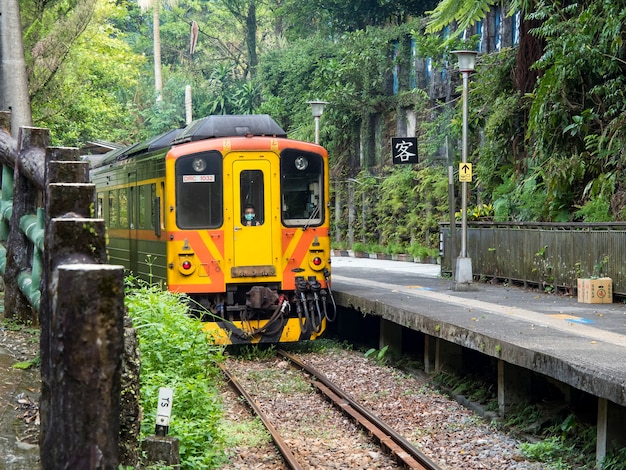 Lingjiao,Taiwan - September 20,2021: Train of Pingxi Railway Line traveling on September 20,2021 in Lingjiao, New Taipei City, Taiwan