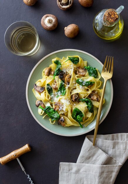 Linguini pasta with mushrooms spinach and cheese Healthy eating Vegetarian food Italian cuisine