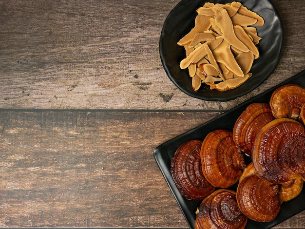 Lingzhi mushroom on wood table for food or medical concept