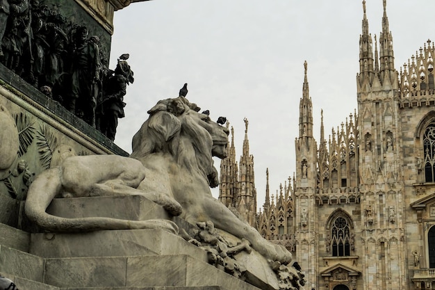 The lion monument is in front of Duomo di Milano