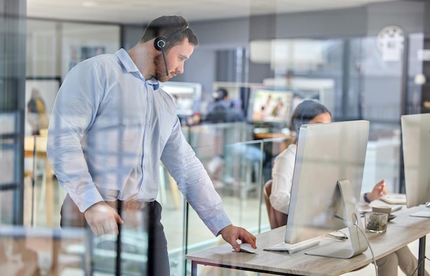 A lion pacing his cage Shot of a young businessman working in a call center