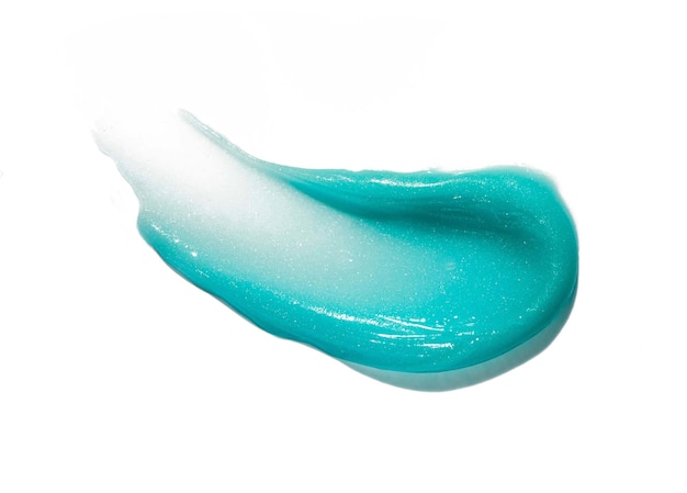 Photo lip balm body or hair butter mask blue emerald colored texture swatch smudge on white background